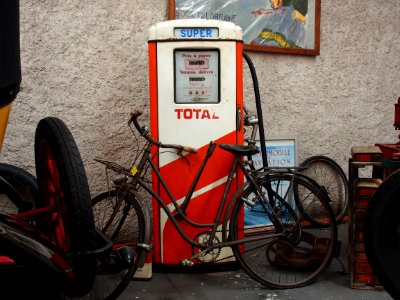 Total, old petrol pump with bicycle parked in front of it, pic3