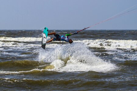 Spray surfboard sand beach photo