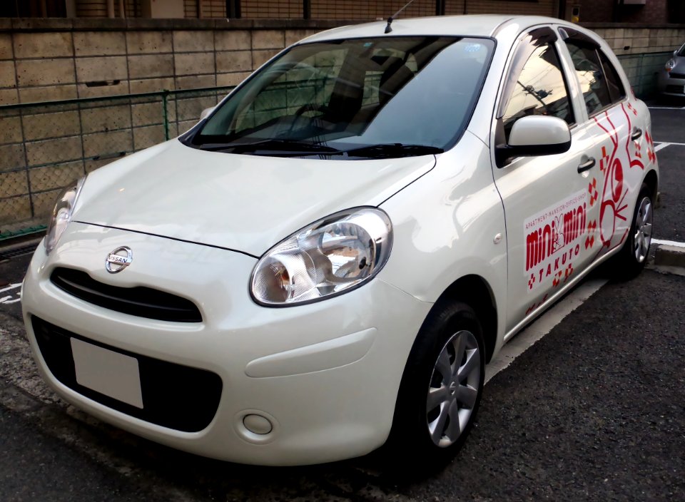 The frontview of Nissan MARCH (K13) as service vehicle of TAKUTO