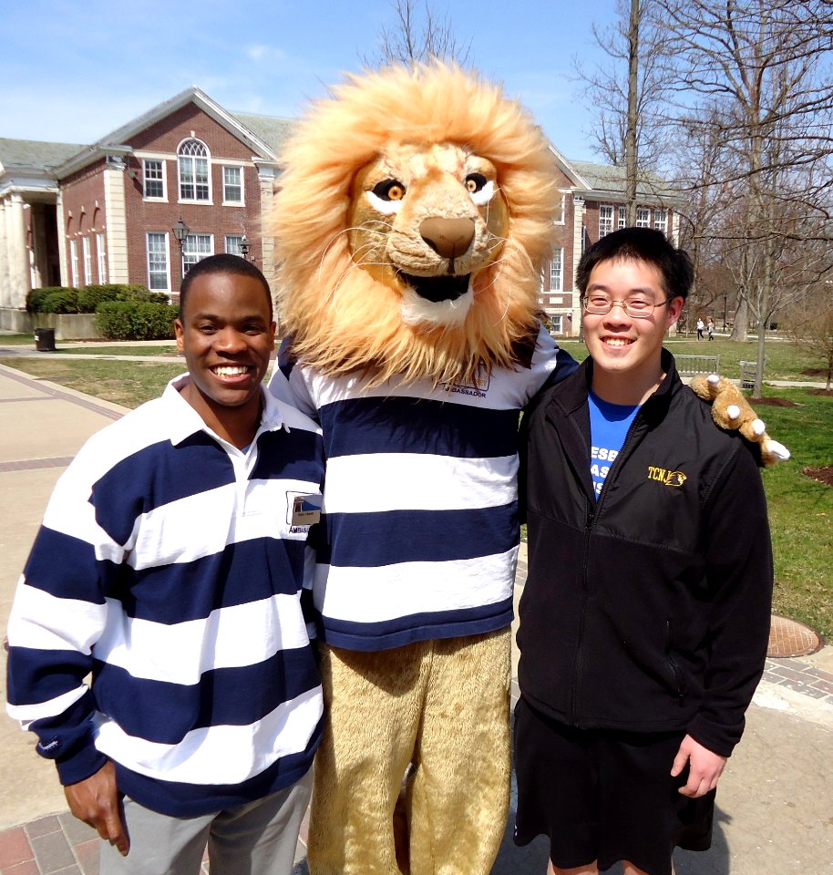 The College of New Jersey mascot with two student welcoming volunteers