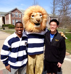 The College of New Jersey mascot with two student welcoming volunteers photo