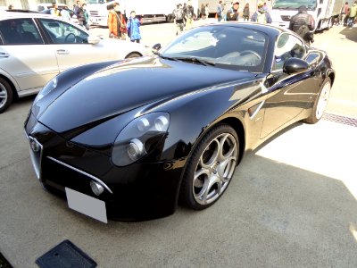 The frontview of black Alfa Romeo 8C Competizione