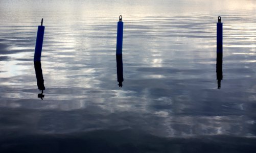 Three pole-shaped mooring buoys in Lahälla