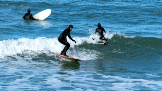 Three surfers at Nørre Vorupør Strand