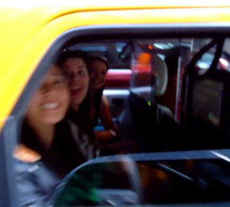 Three women in a taxi in Manhattan who said hello