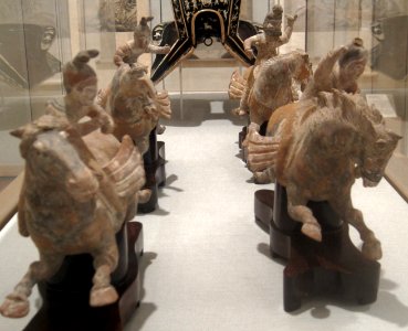Three lady polo players and foreign groom on horseback, China, Tang dynasty, earthenware, HAA