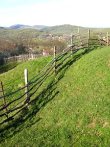 Timber fence, and view over Mihăeşti, Argeş