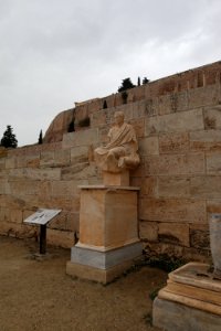 The replica of the bronze statue of the poet Menander at the entrance of the Theatre of Dionysus (336-324 B.C.?) in Athens