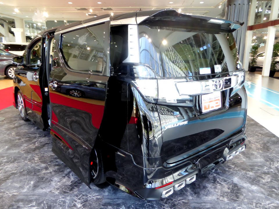 The rearview of Toyota VELLFIRE V 2WD (AGH30W) with "TRD Customize Parts"