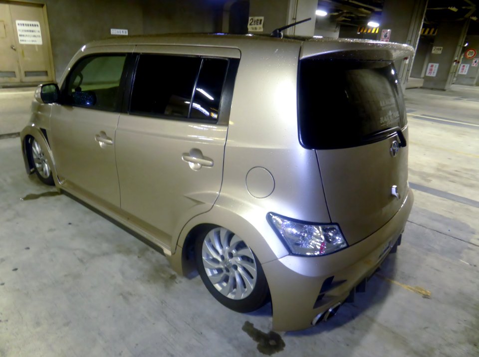 The rearview of Toyota bB (QNC20) with body lowered