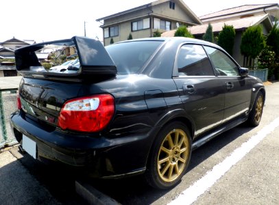 The rearview of black Subaru IMPREZA WRX STi (GDB)