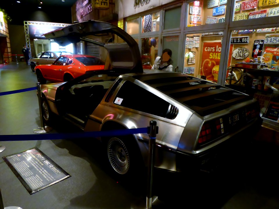 The rearview of 1981 De Lorean DMC-12 (Great Scott! Her passenger door isn't open)