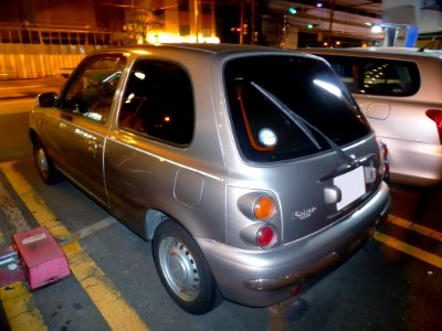 The rearview of Nissan MARCH Bolero 3door (K11) at night