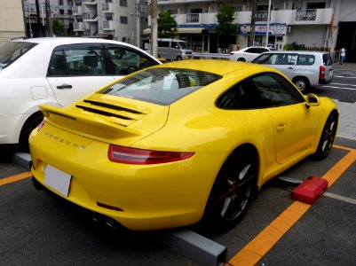 The rearview of yellow Porsche 991 Carrera S