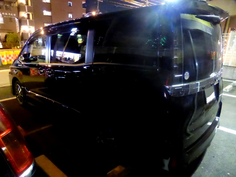 The rearview of Toyota VOXY ZS (R80W) at night