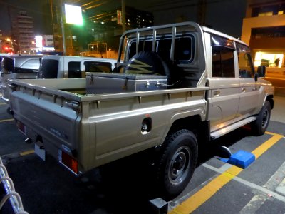 The rearview of Toyota LAND CRUISER 70 PICKUP at night