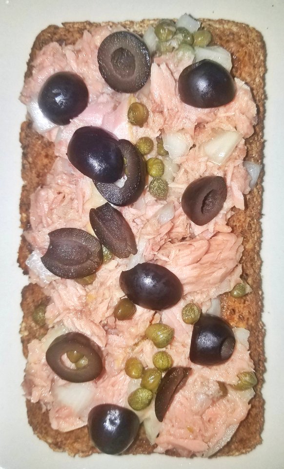 Tuna sandwich with capers, black olives, onion, and black pepper on German four-grain toast - Massachusetts