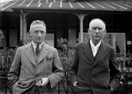 Two men outside Llandrindod Wells Golf Club pavilion (1295063)
