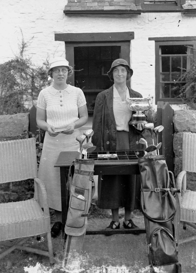 Two ladies with golf clubs, one holding a trophy, Builth Wells Golf Club (1293629)