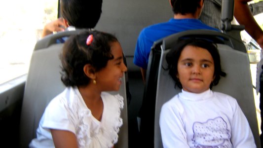 Two happy girl sited on chair - Nishapur 2