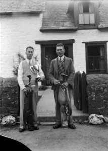 Two men with golf clubs, one holding a trophy, Builth Wells Golf Club (1294364)