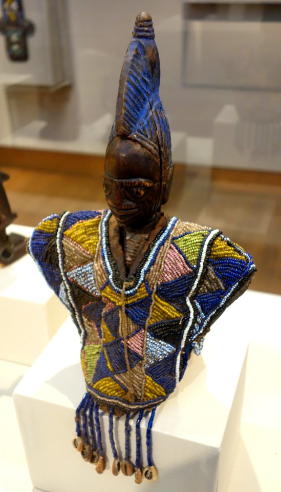 Twin Memorial Figure (ere Ibeji) with Beaded Garment (ewu ileke), Nigeria, Yoruba people, 19th-20th century, wood, beads, cowrie shells, paint, fabric, leather - Chazen Museum of Art - DSC01831
