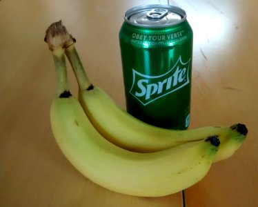 Two bananas and a can of Sprite