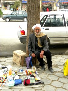 Old Nishapuri Man Leaning against a tree