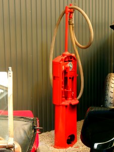 Old red petrol pump