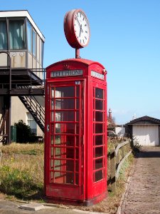 Old telephonebooth with clock at IJmuiden pic1