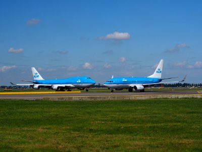 PH-BFC KLM Royal Dutch Airlines Boeing 747-406(M) and PH-BGW KLM Royal Dutch Airlines Boeing 737-7K2(WL) taxiing at Schiphol (AMS - EHAM), The Netherlands, 18may2014, pic-024 photo