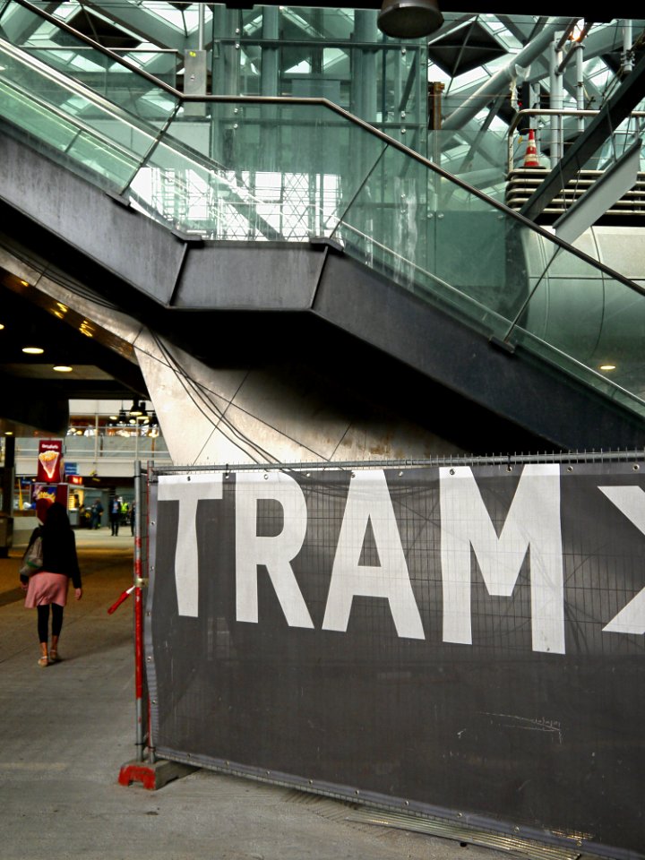 Photo of a large canvas-sign to find the tram platform in Central station The Hague; high resolution image by FotoDutch, June 2013