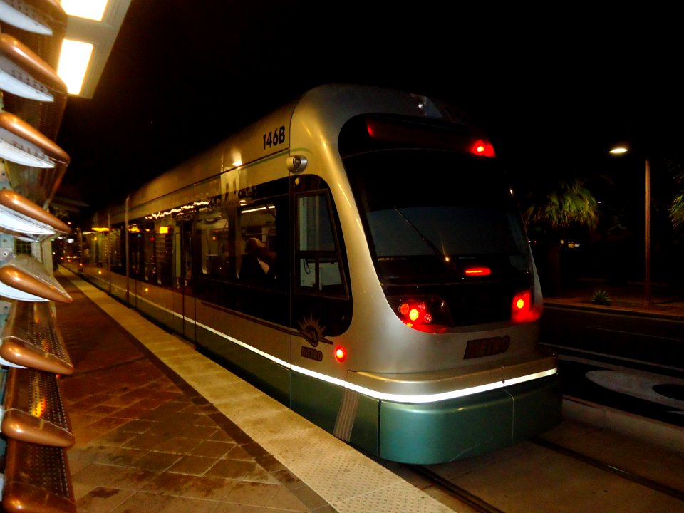 Phoenix day stay light rail Valley Metro train car in station at night