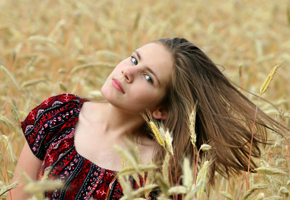 Hair girl in a field harvest