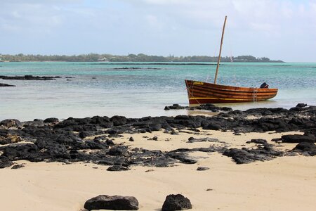 Wooden boat rock mauritius photo