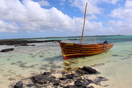 Wooden boat rock mauritius photo
