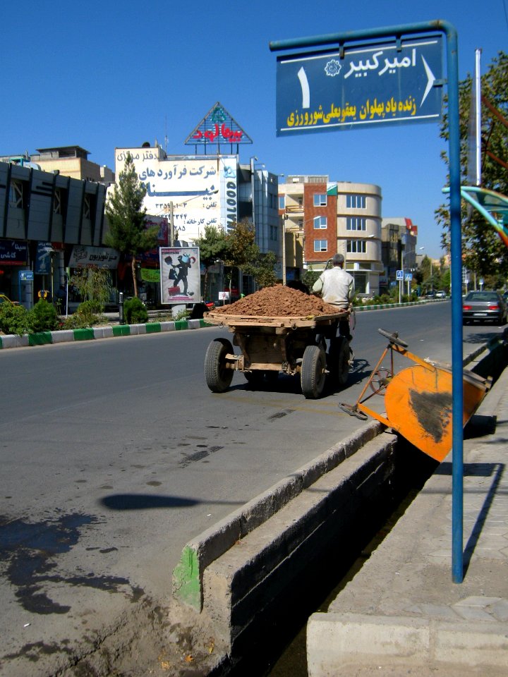 Portage horse - a man giving water to her horse with pail aside of Amir Kabir St - Nishapur 35