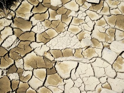 Mud cracked earth dry land photo