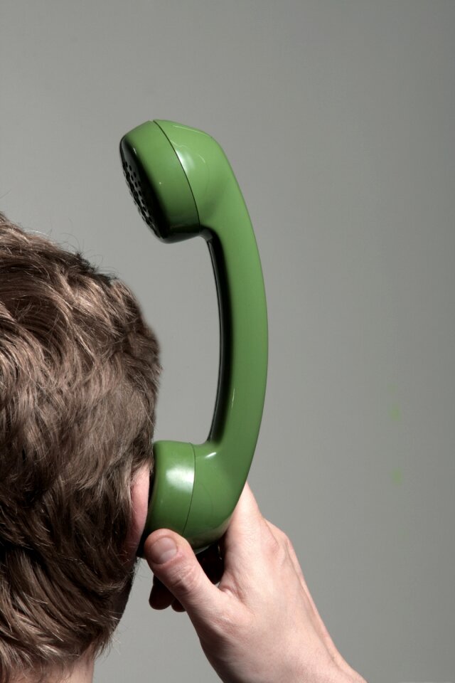 Man listeners phone