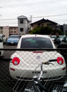 Rear of Volkswagen New Beetle & front of Volkswagen the Beetle
