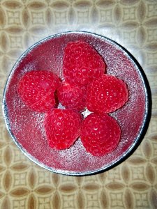 Raspberries in a little bowl photo