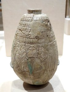 Relief-decorated Ovoid Bottle - Egypt, reportedly from Deir el Nawahid near Abydos, Third Intermediate Period, perhaps Dynasty XXII, c. 945-718 BC, glazed faience - Brooklyn Museum - Brooklyn, NY - DSC08762