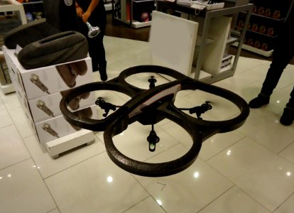 Remote controlled flying machine with four helicopter blades photo