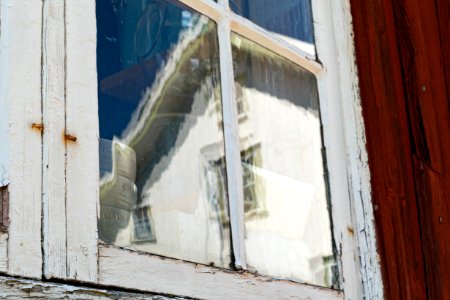 Reflection in a window with hand-blown glass 1 photo