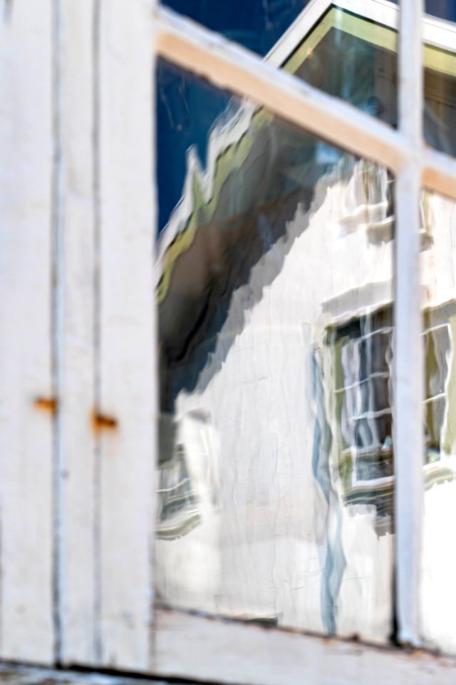 Reflection in a window with hand-blown glass 3