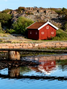 Red building and jetty in Norra Grundsund photo