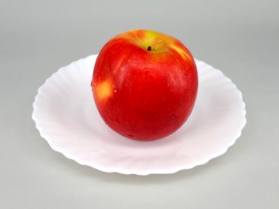 Red apple on a plate 2017 A