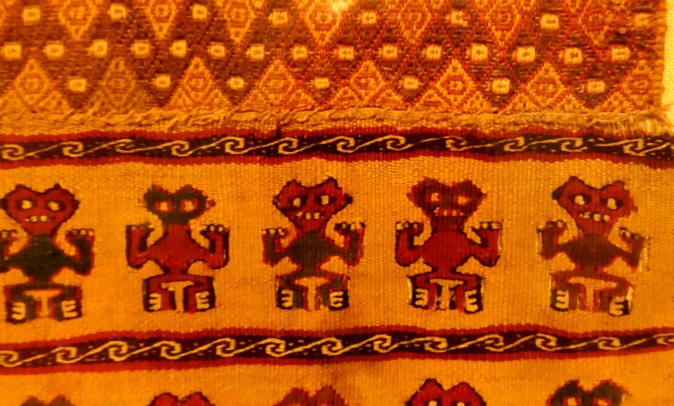 Rectangular tapestry panel with stylized humans, Peru, Central Coast Wari at Ancon, c. 1000-1470 AD, cotton, alpaca wool, view 2 - Krannert Art Museum, UIUC - DSC06475