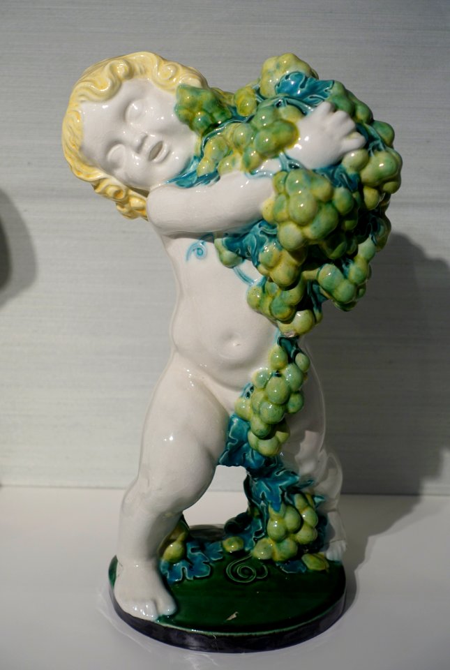 Putto 'Autumn' by Michael Powolny, Wiener Keramik, c. 1907, majolica - Hessisches Landesmuseum Darmstadt - Darmstadt, Germany - DSC00859