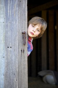 Barn door young boy wooden door photo